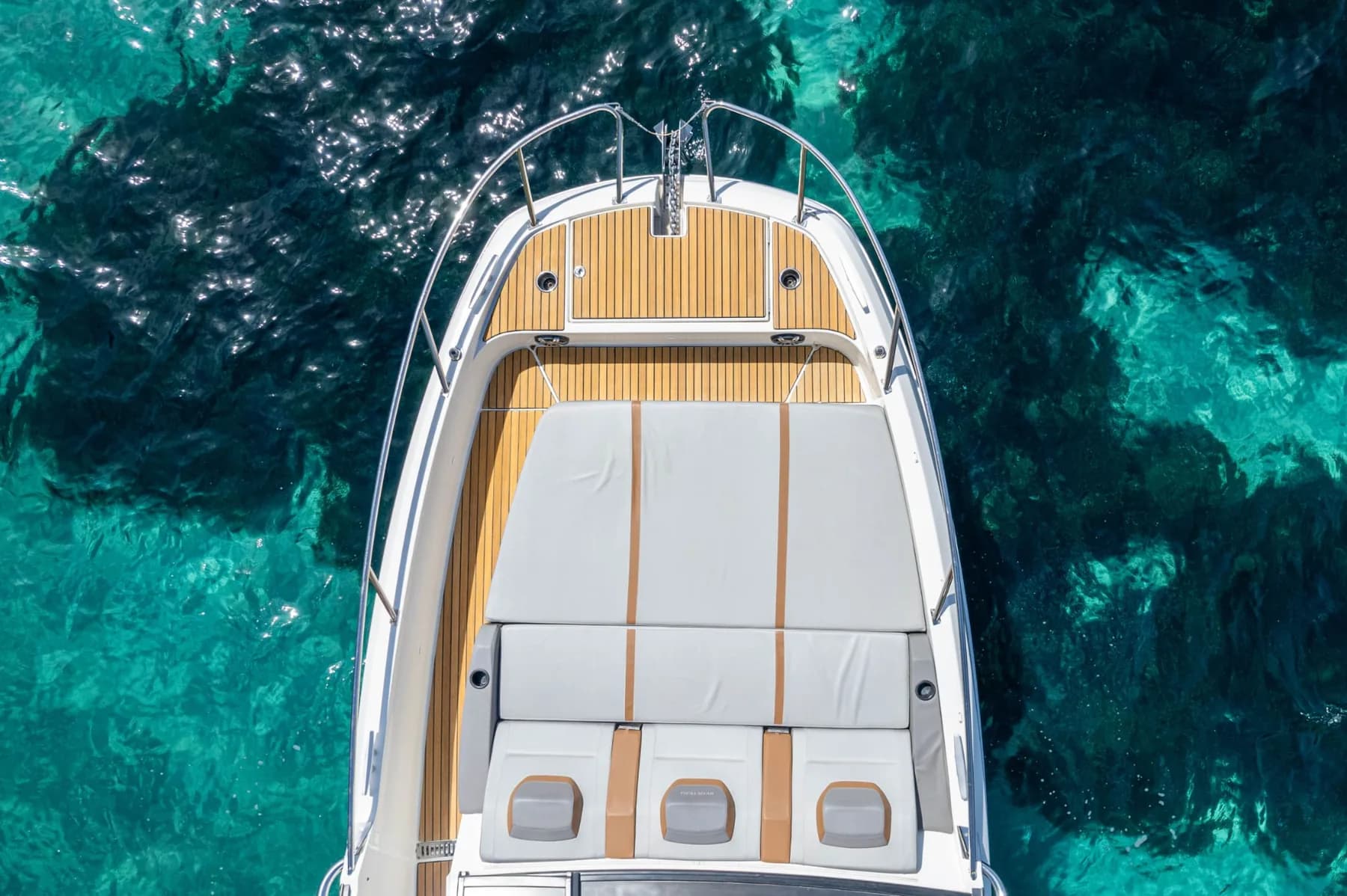 Aerial top-down view of the boat's bow sundeck