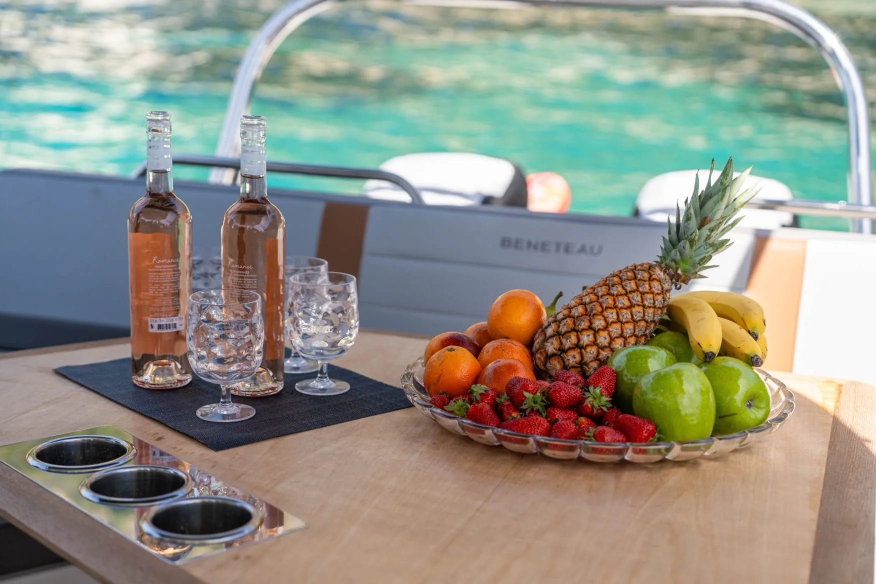 Chilled rosé and fresh fruit platter onboard